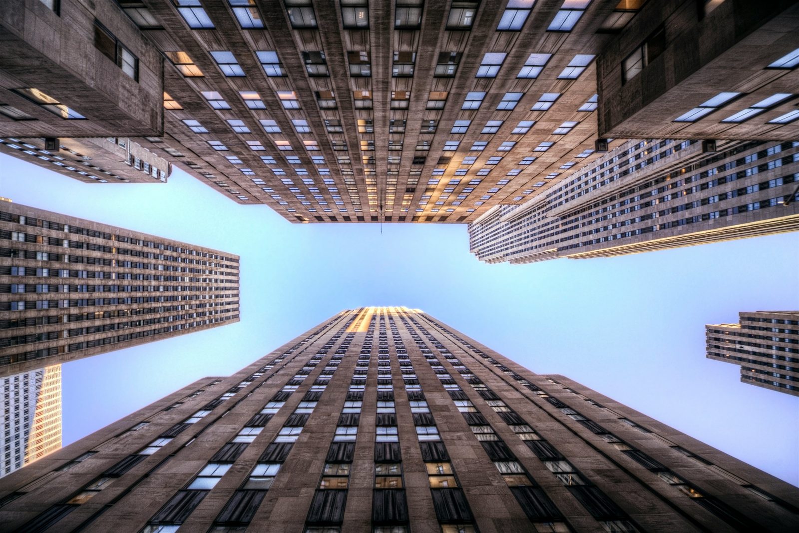Upward view of Manhattan skyscrapers representing the EB-5 green card pathway for Indian and Chinese H-1B and F-1 visa holders