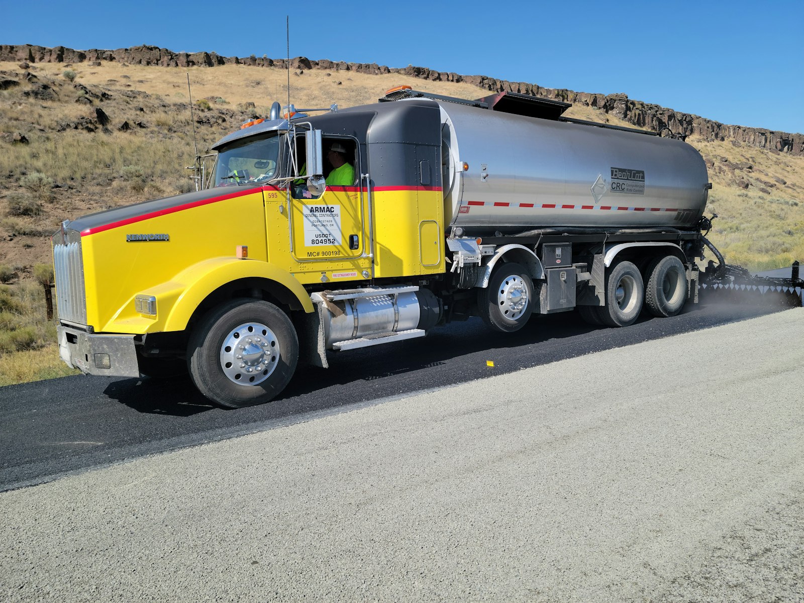 Highway maintenance truck on a rural road in Oregon