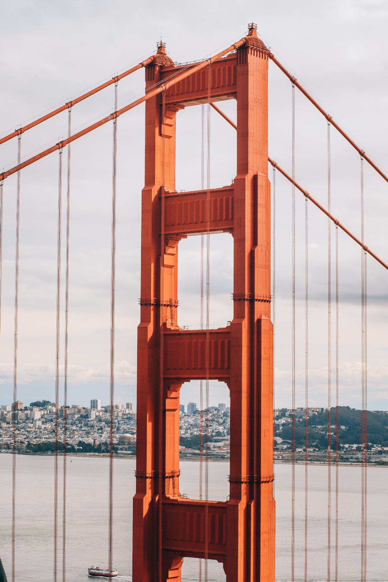 Golden Gate Bridge tower with San Francisco skyline behind, representing the path to U.S. permanent residency through EB-5